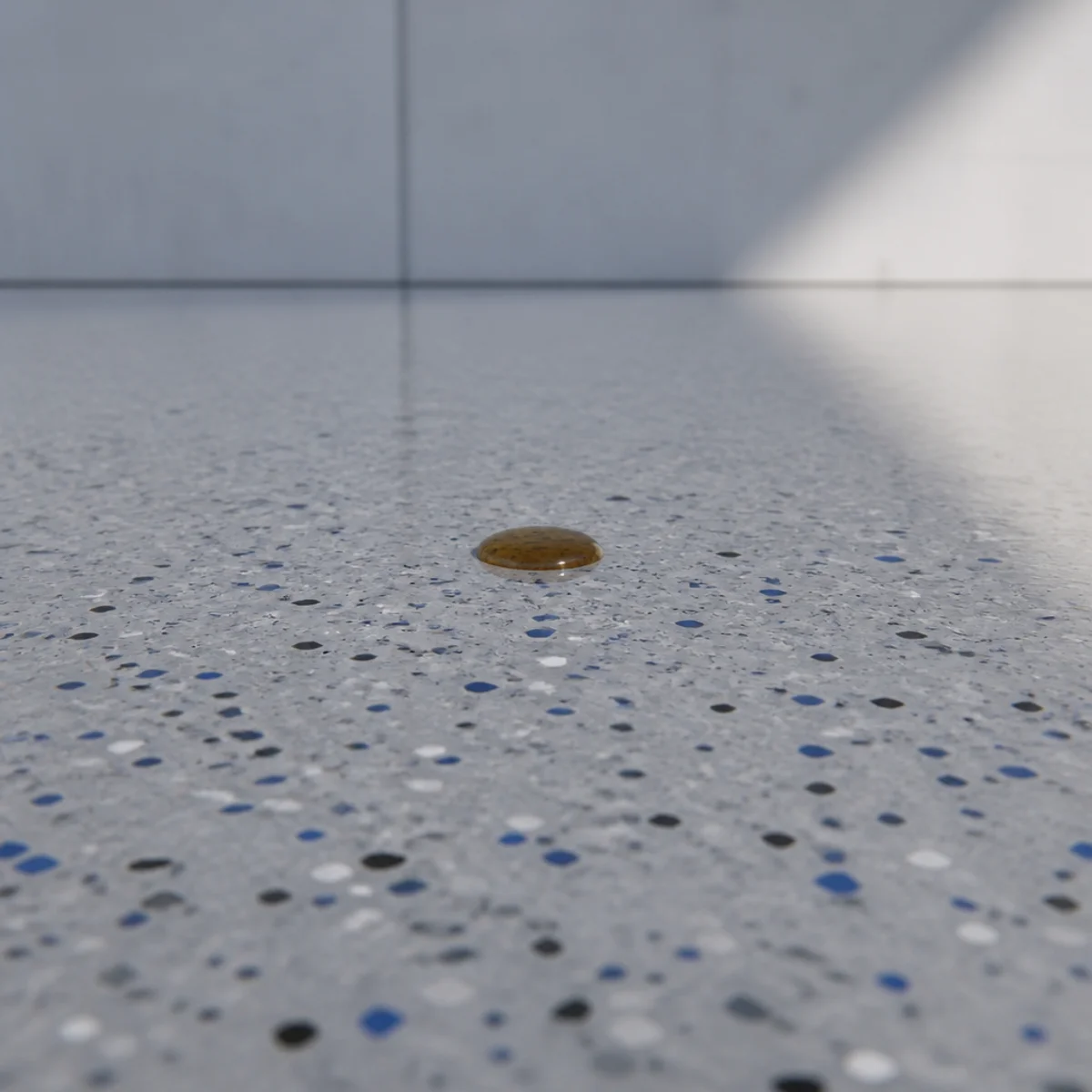 Oil beading on a chemical-resistant workshop floor